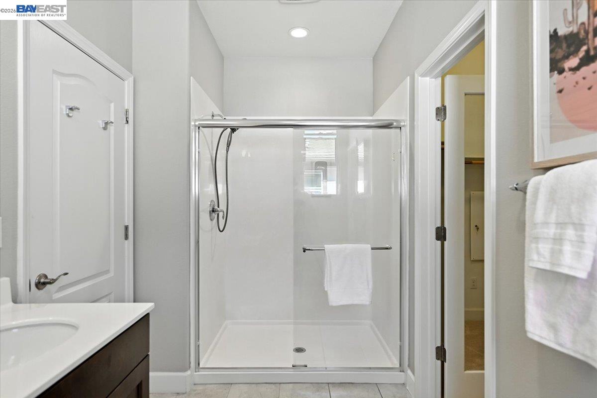 437 Ryan Terrace San Ramon, CA 94583 - Photo 20 of 30 a bathroom with a shower sink and mirror