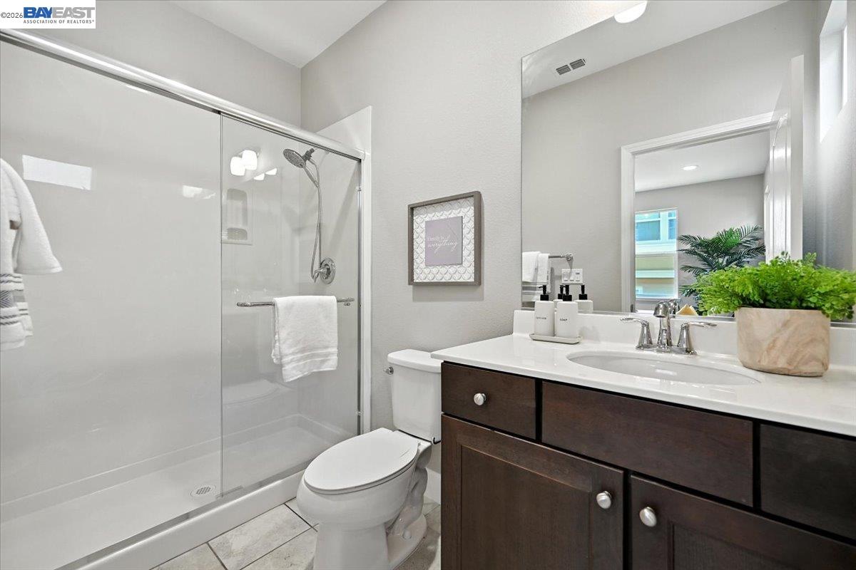 437 Ryan Terrace San Ramon, CA 94583 - Photo 6 of 30 a bathroom with a sink vanity granite toilet and shower