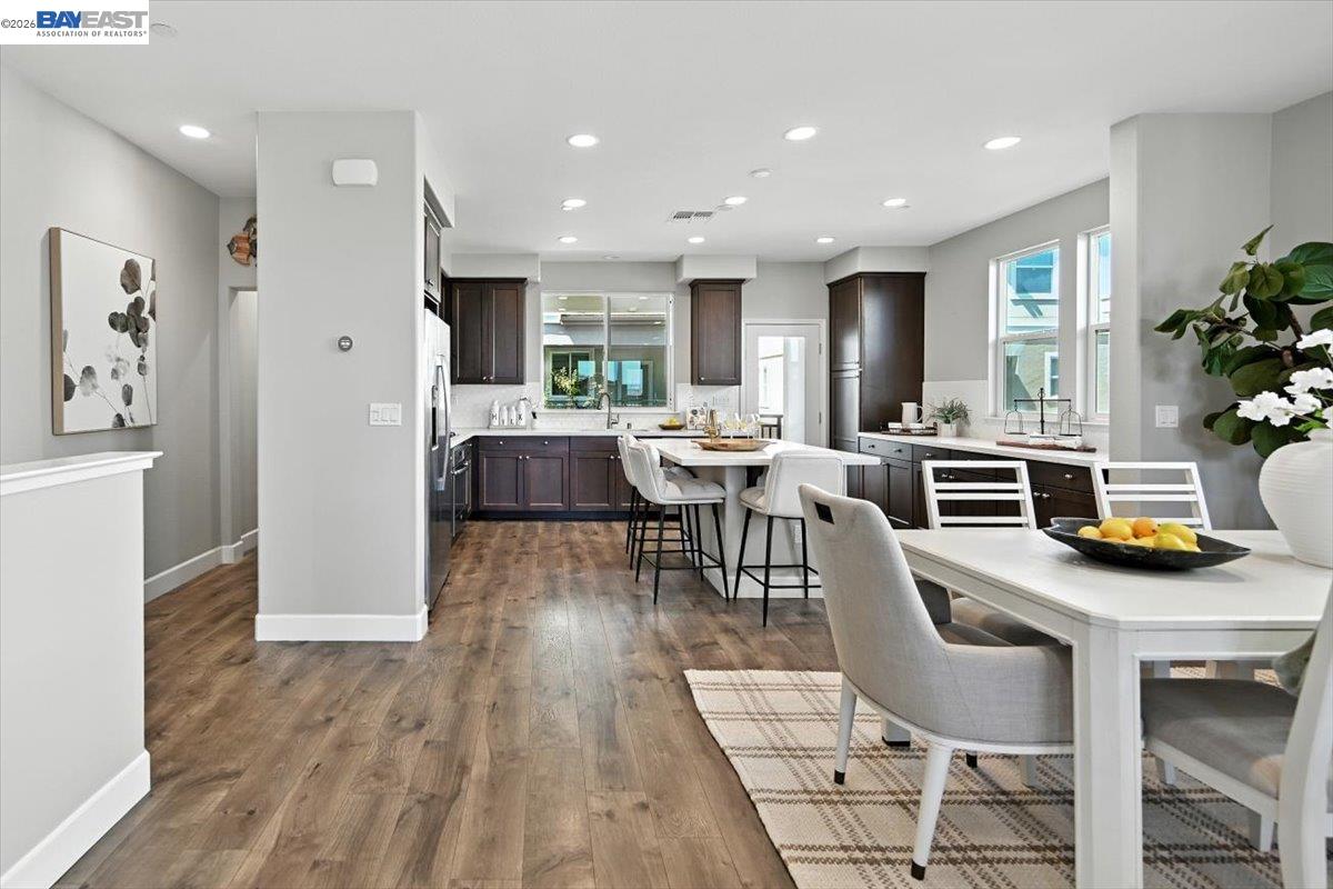 437 Ryan Terrace San Ramon, CA 94583 - Photo 9 of 30 a view of a dining room with furniture and wooden floor