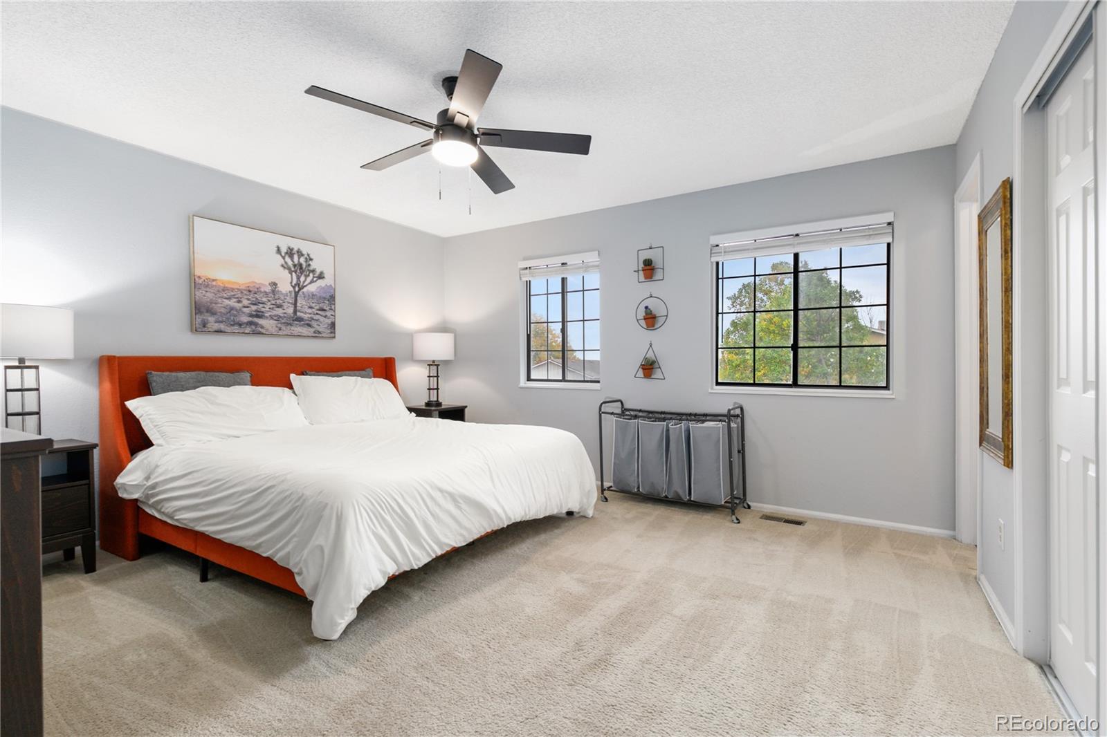 11841 West Dumbarton Drive Morrison, CO 80465 - Photo 17 of 45 a bedroom with a bed dresser and a window