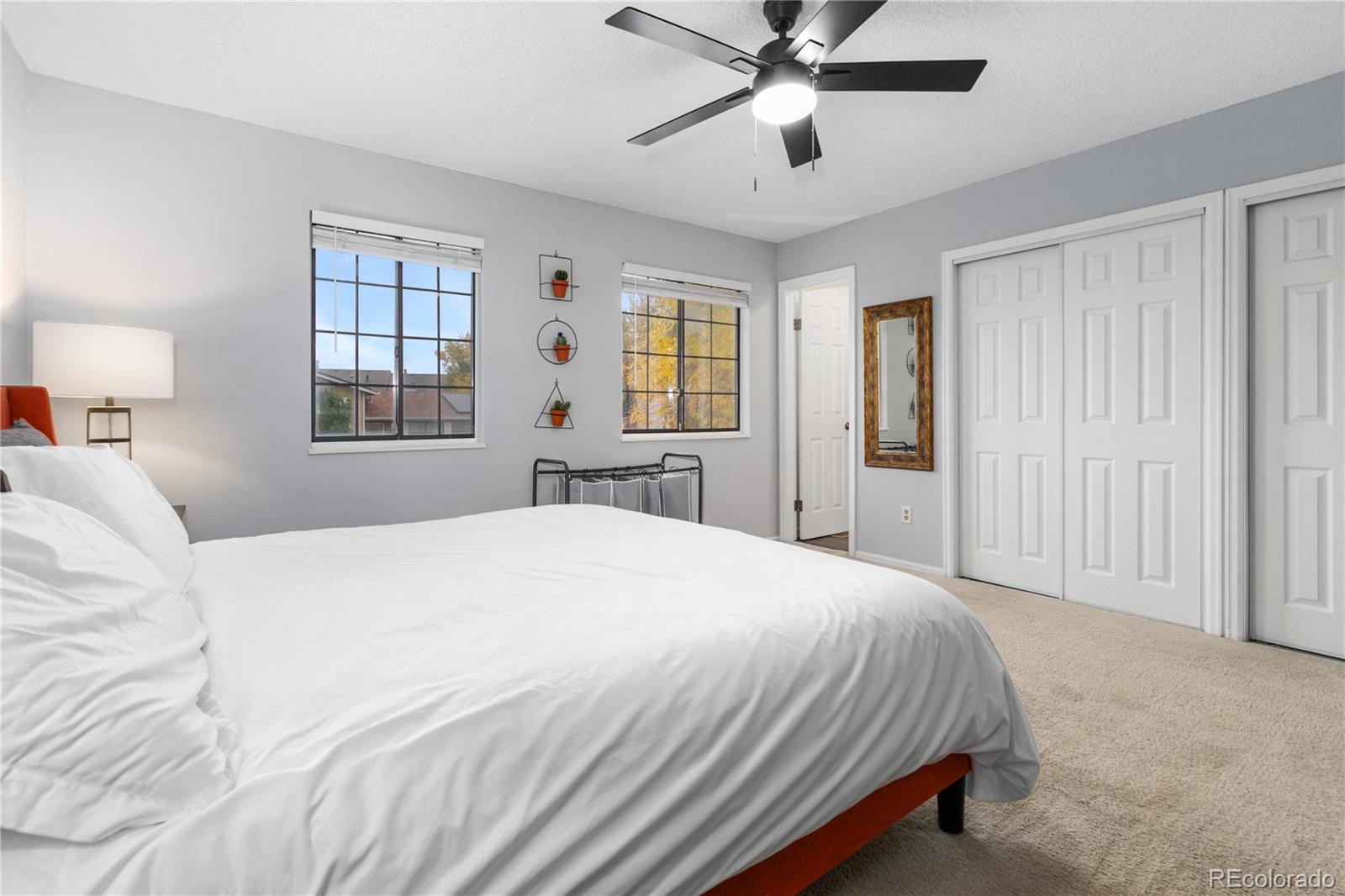 11841 West Dumbarton Drive Morrison, CO 80465 - Photo 18 of 45 a bedroom with a large bed and a window