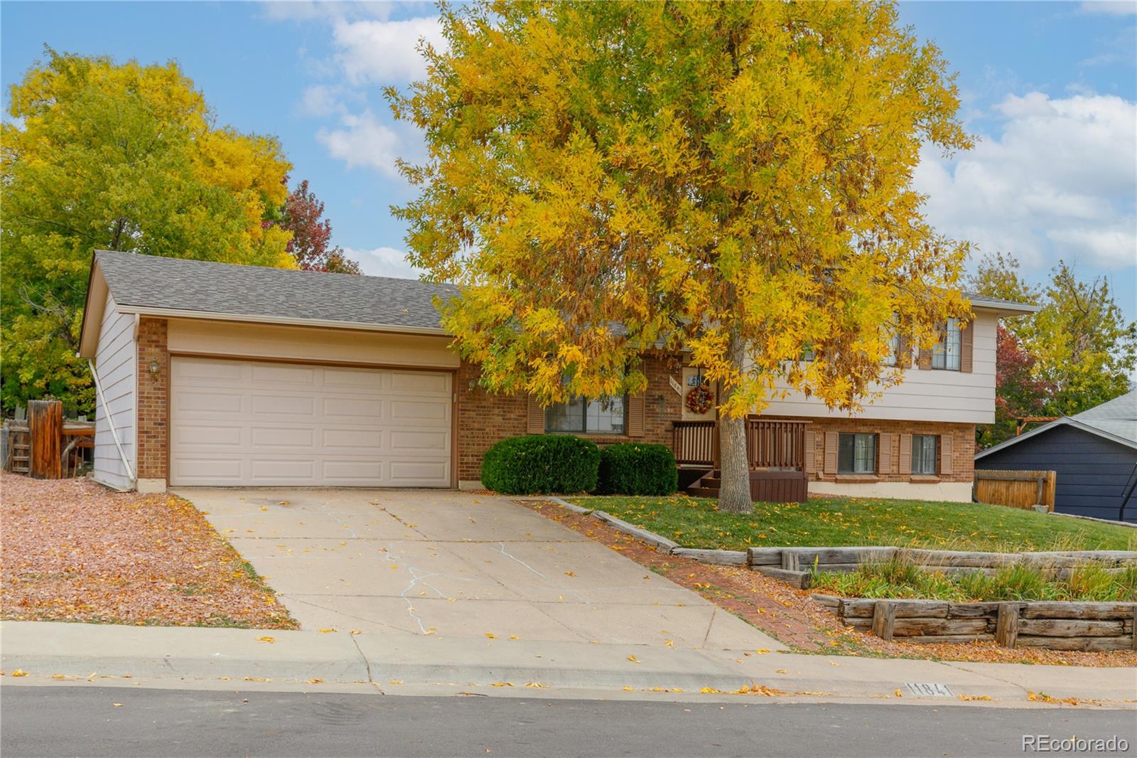 11841 West Dumbarton Drive Morrison, CO 80465 - Photo 2 of 45 front view of a house with a yard