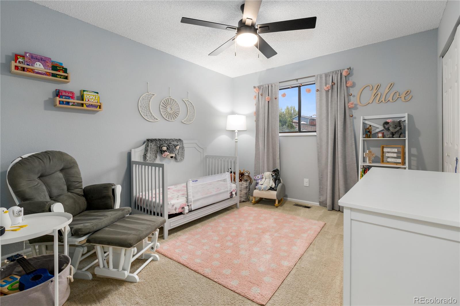 11841 West Dumbarton Drive Morrison, CO 80465 - Photo 21 of 45 a living room with furniture and a rug