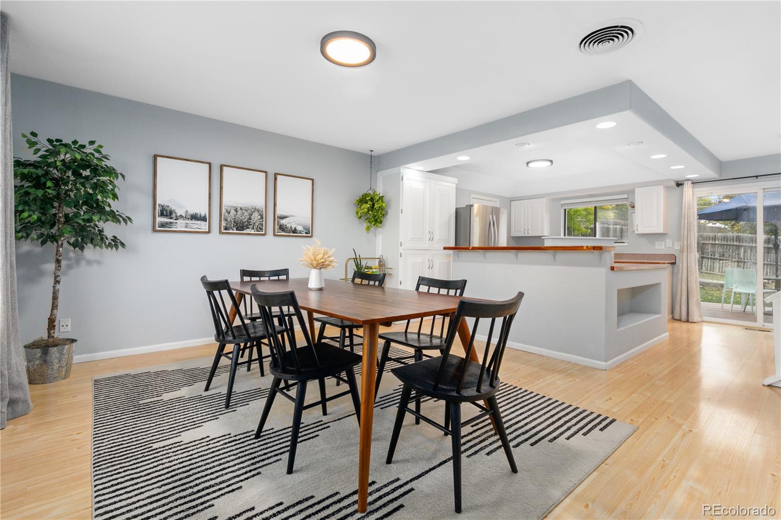 11841 West Dumbarton Drive Morrison, CO 80465 - Photo 6 of 45 a view of a dining room with furniture and wooden floor
