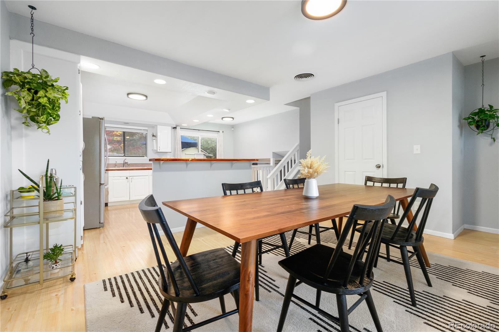 11841 West Dumbarton Drive Morrison, CO 80465 - Photo 8 of 45 a view of a dining room with furniture and wooden floor