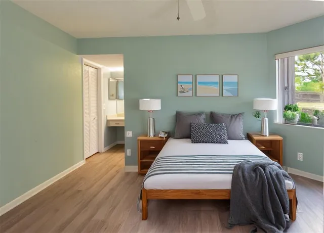 a bedroom with a bed and window