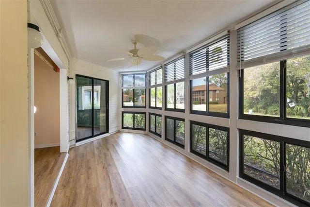 a view of an entryway with wooden floor