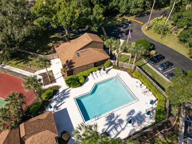 an aerial view of a residential houses with outdoor space
