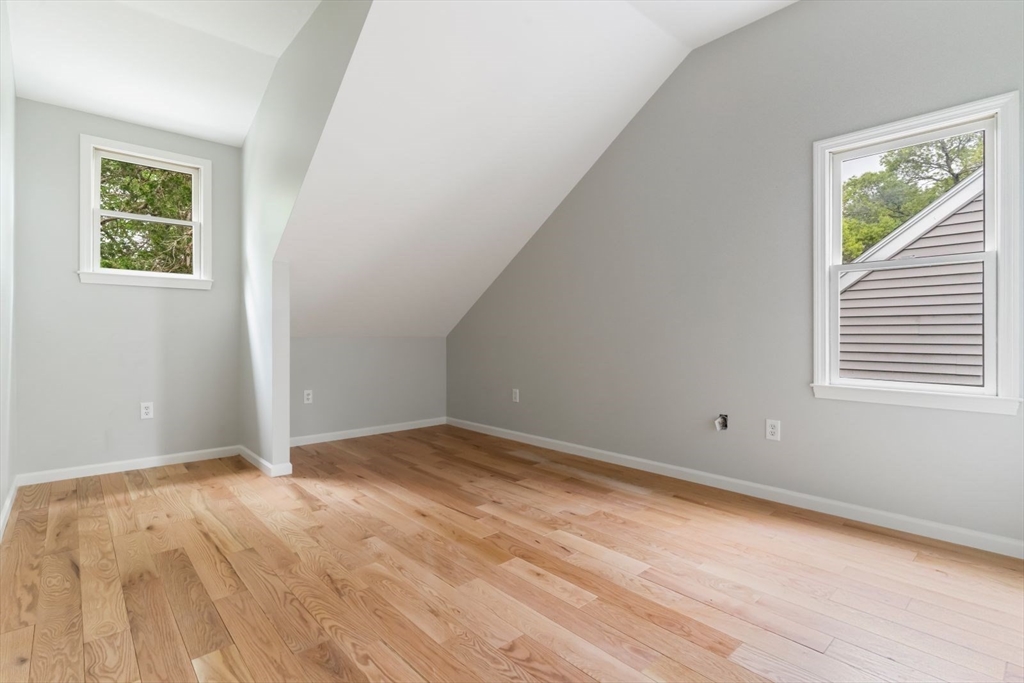 20 Dudley Road Wayland, MA 01778 - Photo 14 of 27 a view of an empty room with wooden floor and a window