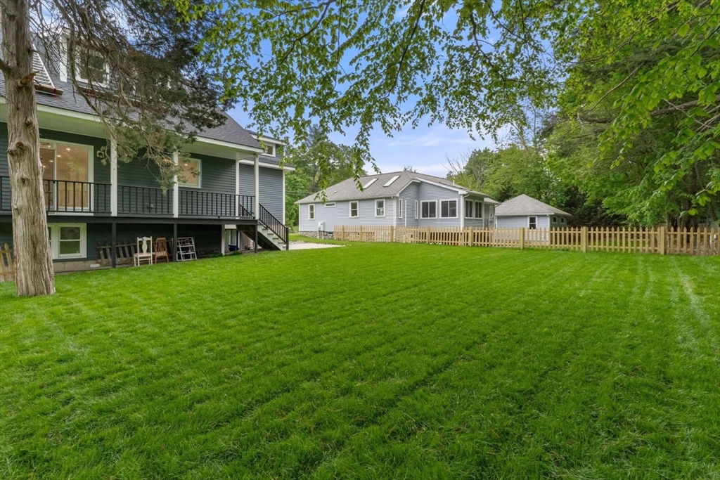 20 Dudley Road Wayland, MA 01778 - Photo 22 of 27 a front view of a house with a yard and trees