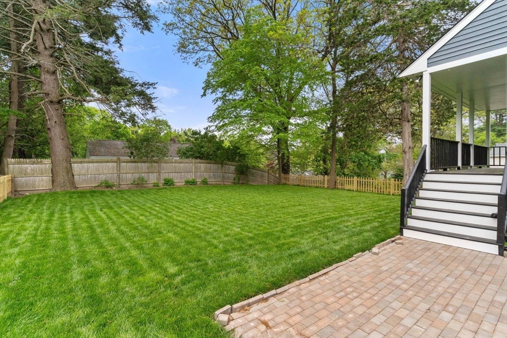 20 Dudley Road Wayland, MA 01778 - Photo 24 of 27 a view of a backyard with a garden