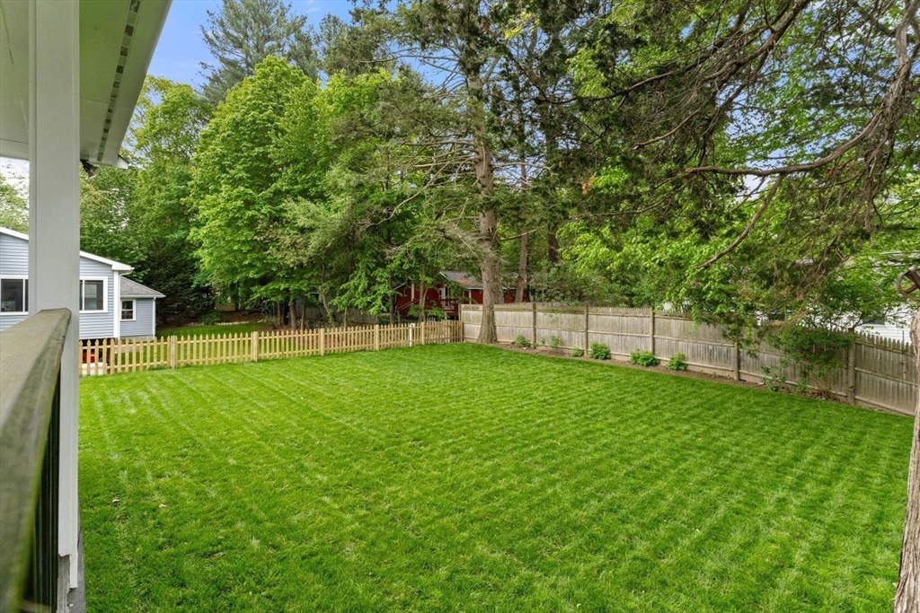 20 Dudley Road Wayland, MA 01778 - Photo 25 of 27 a view of a backyard with a garden