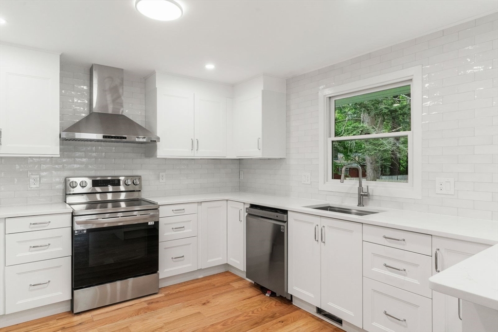 20 Dudley Road Wayland, MA 01778 - Photo 3 of 27 a kitchen with a stove a sink and a window