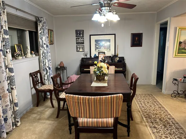 a view of a dining room with furniture