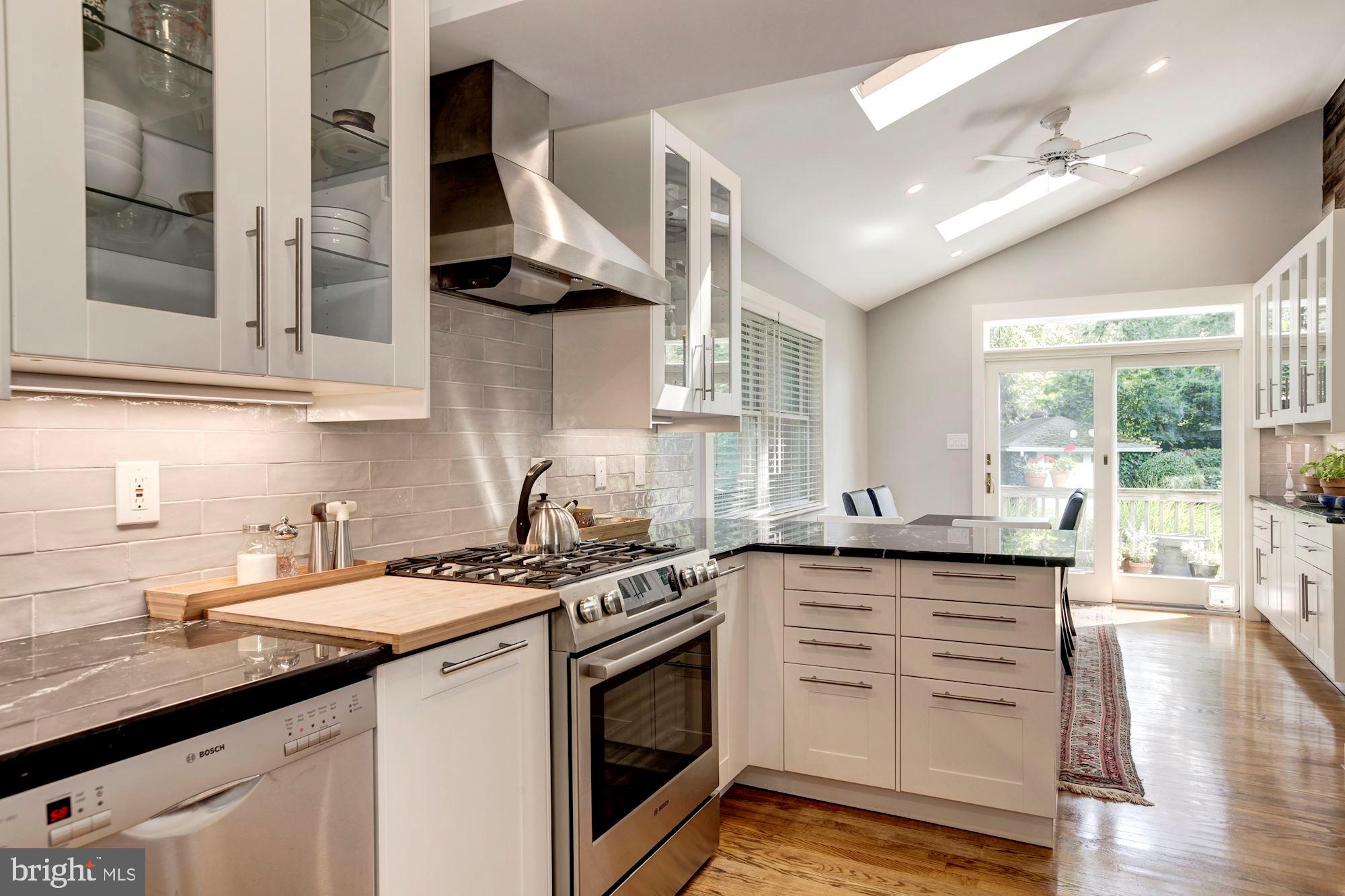 6212 Walhonding Road Bethesda, MD 20816 - Photo 25 of 60 Kitchen view to eat-in space and doors to deck