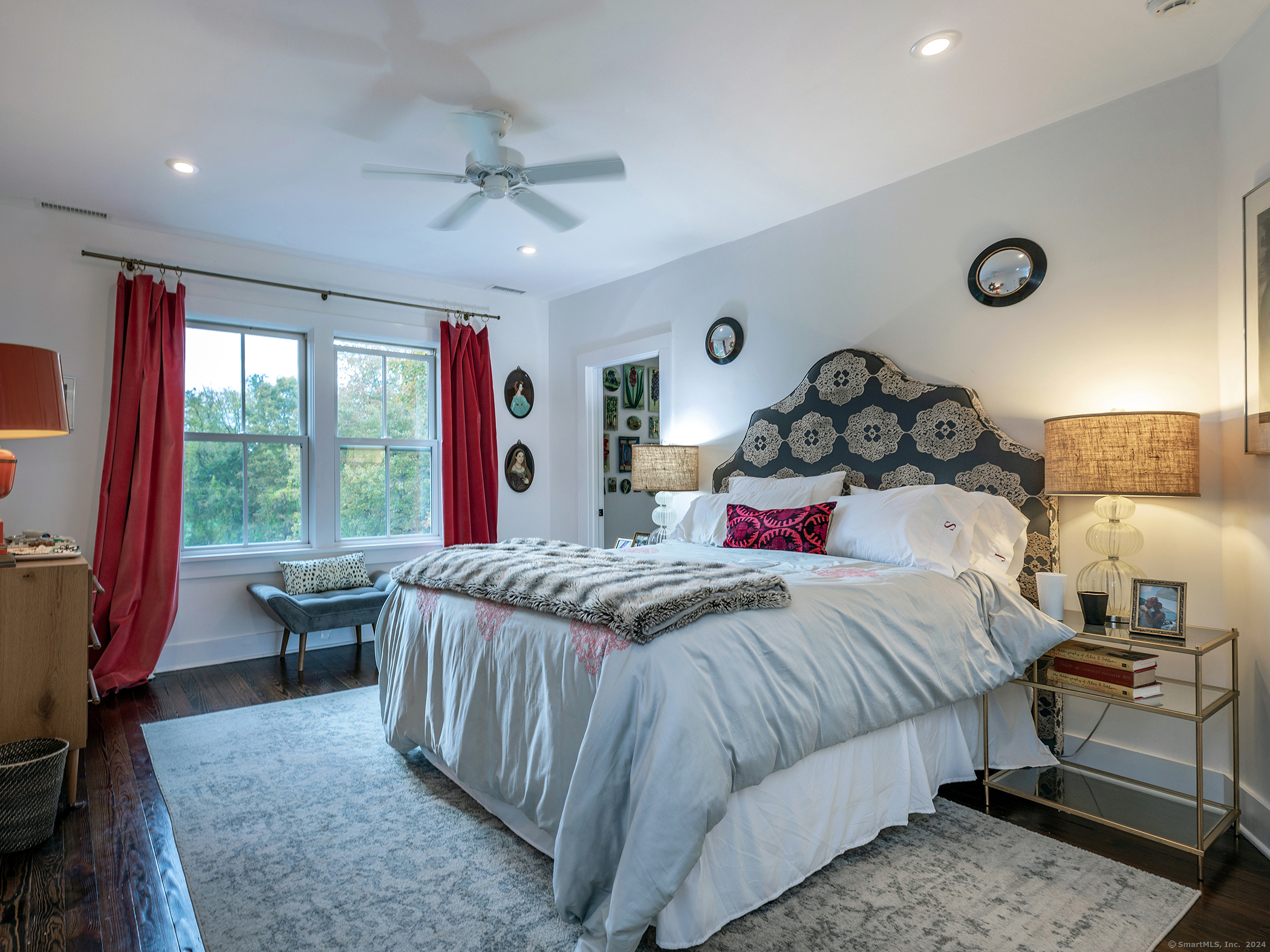 379 Lake Road Warren, CT 06777 - Photo 18 of 36 a bedroom with a large bed and a large window