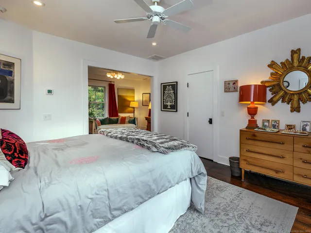 a bedroom with a bed and dresser