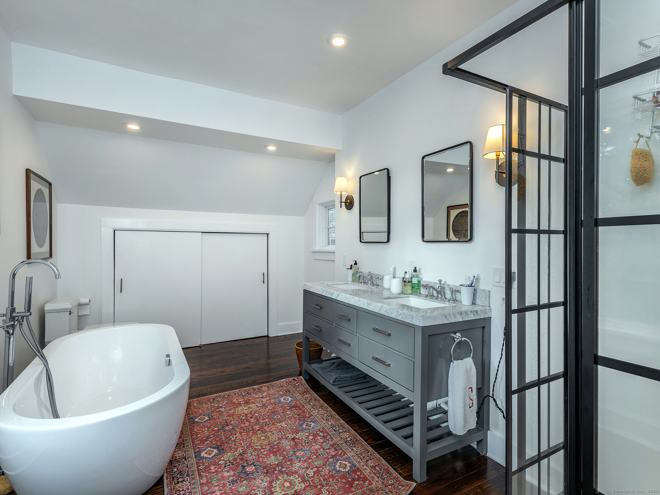 379 Lake Road Warren, CT 06777 - Photo 21 of 36 a spacious bathroom with a bathtub and sink