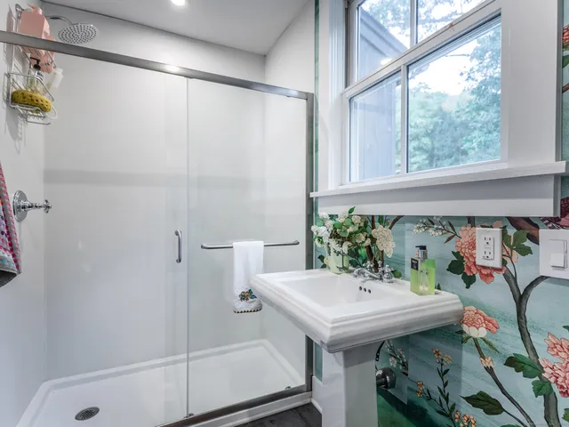 a bathroom with a sink and mirror