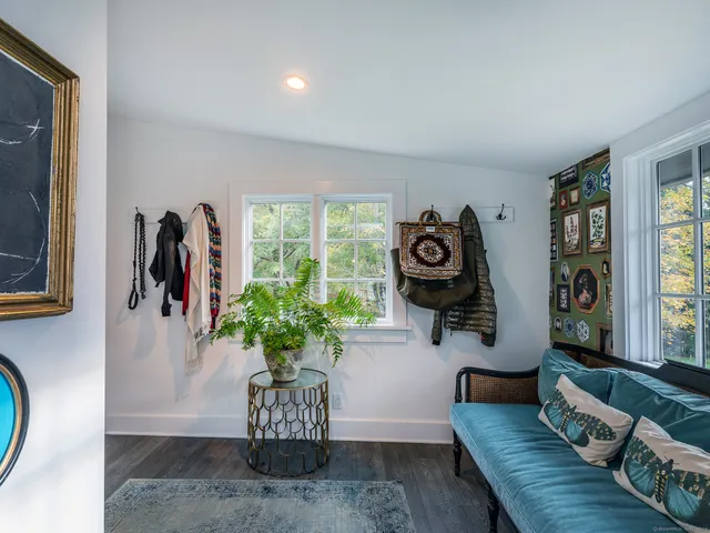 a view of a living room and entryway