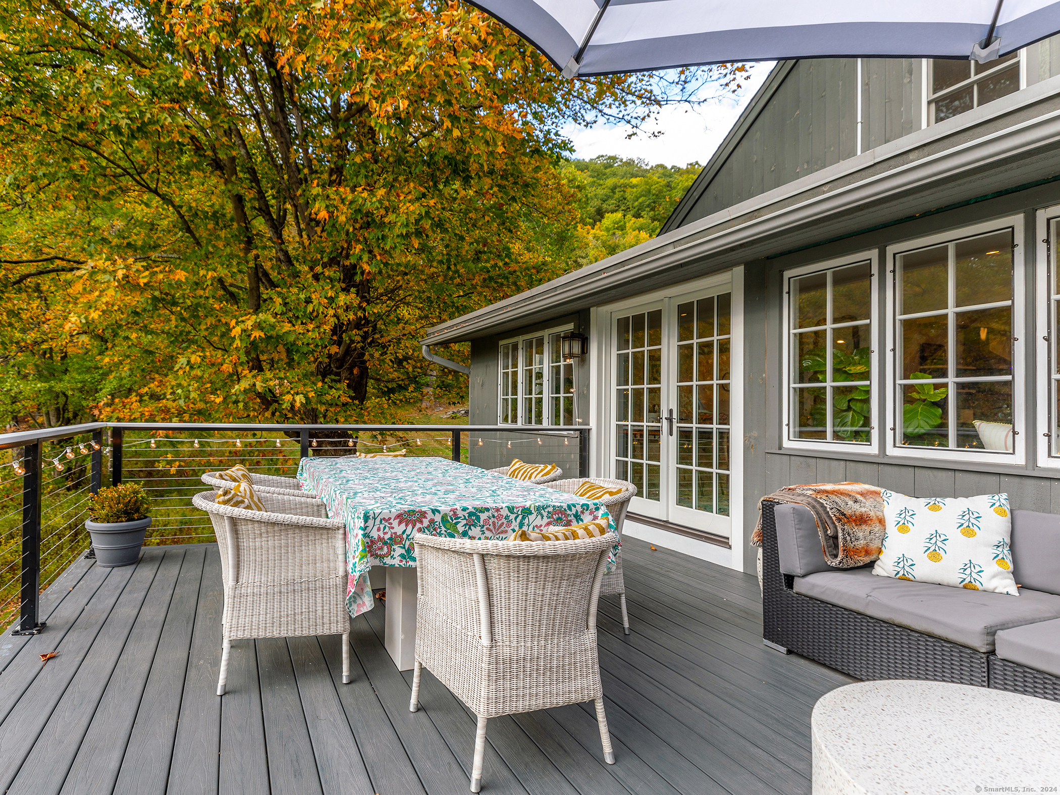 379 Lake Road Warren, CT 06777 - Photo 3 of 36 a balcony with table and chairs