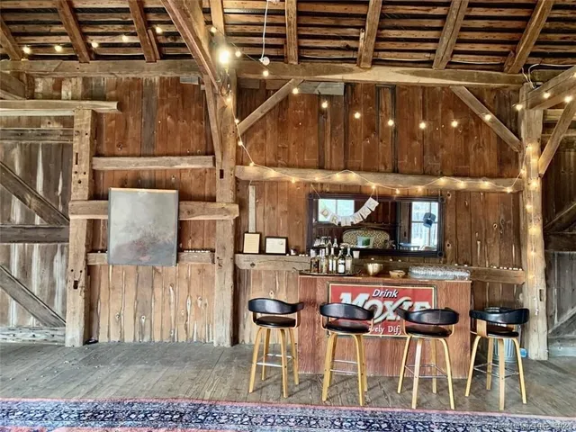 a view of dinning table and chairs in a patio