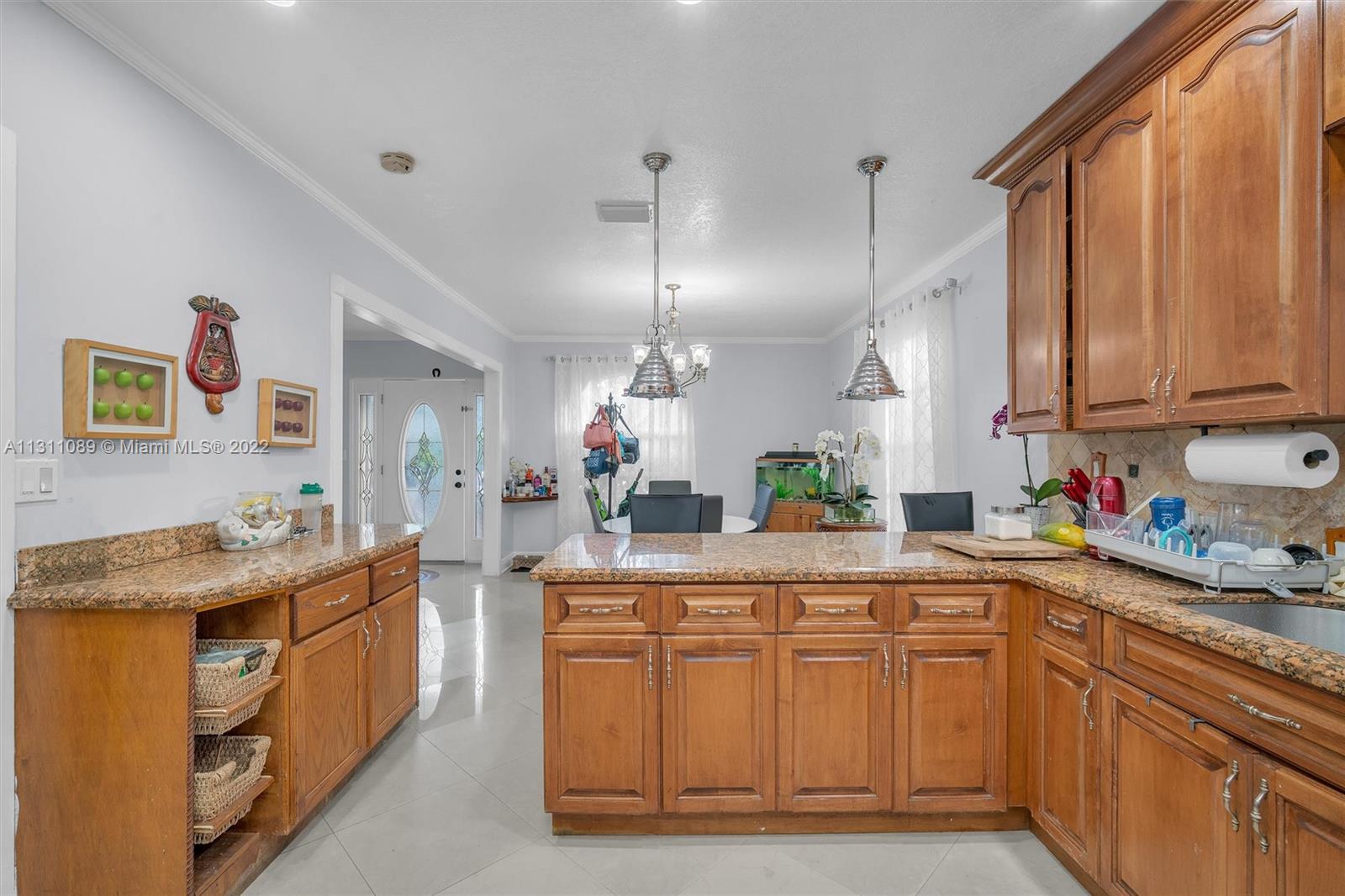 Allapattah Miami, FL 33125 - Photo 15 of 37 a kitchen with a sink and cabinets
