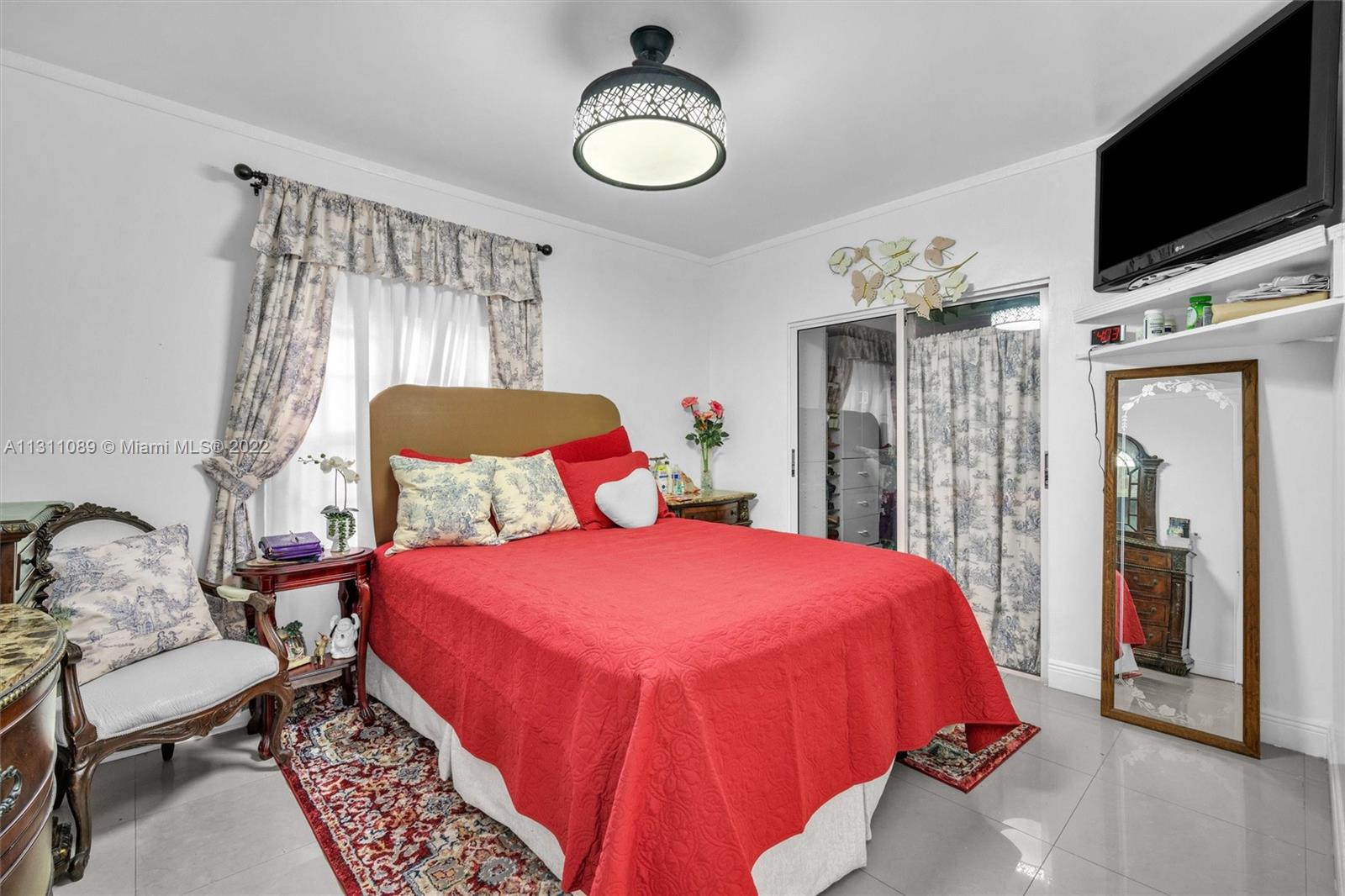 Allapattah Miami, FL 33125 - Photo 18 of 37 a bedroom with a bed and flat screen tv