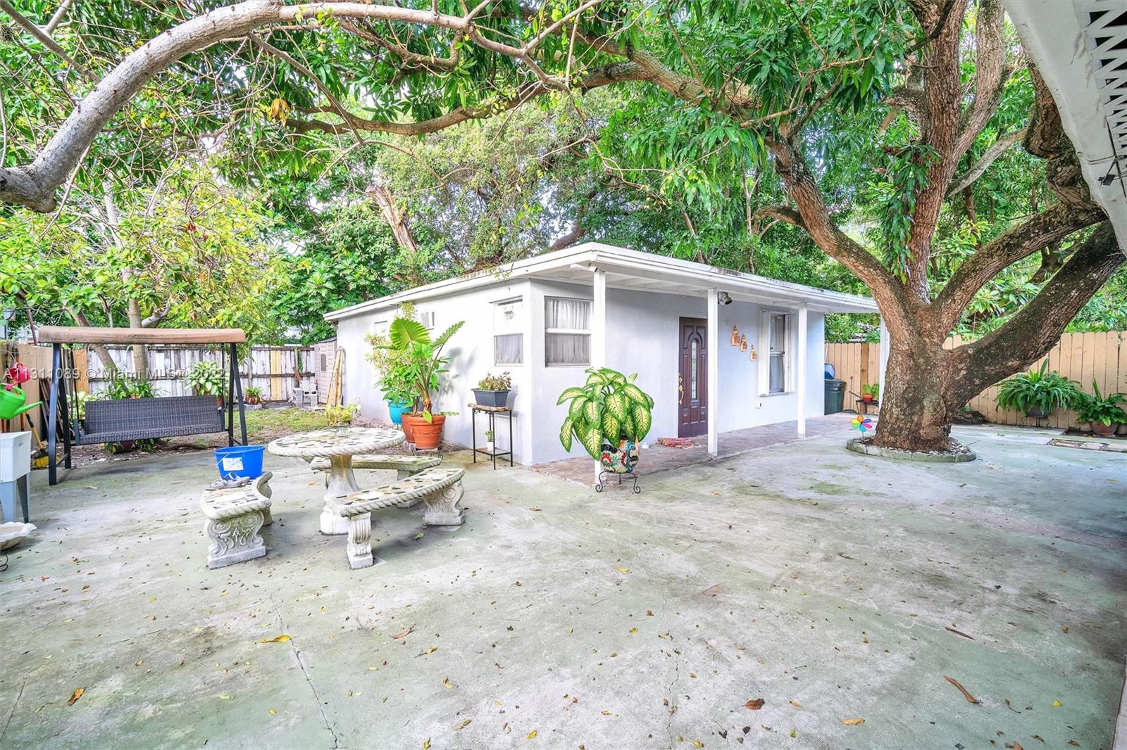Allapattah Miami, FL 33125 - Photo 25 of 37 a view of a chair and table in backyard of the house