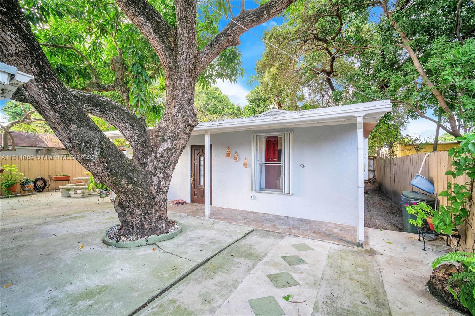 Allapattah Miami, FL 33125 - Photo 26 of 37 a front view of a house with garden