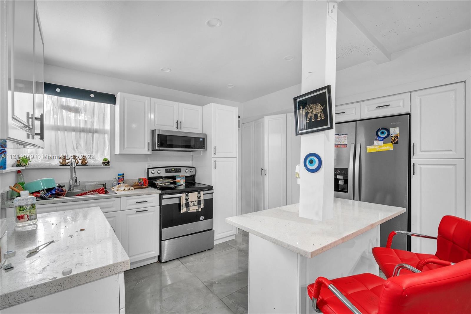 Allapattah Miami, FL 33125 - Photo 28 of 37 a kitchen with stainless steel appliances kitchen island granite countertop a sink dishwasher stove and refrigerator with wooden floor
