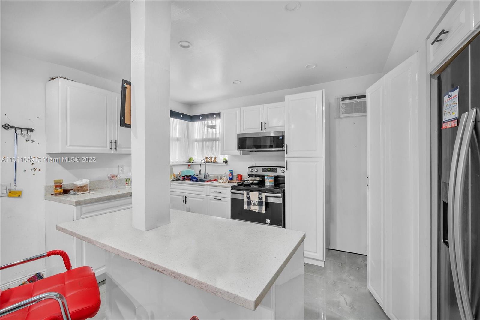Allapattah Miami, FL 33125 - Photo 29 of 37 a kitchen with stainless steel appliances a refrigerator sink and cabinets