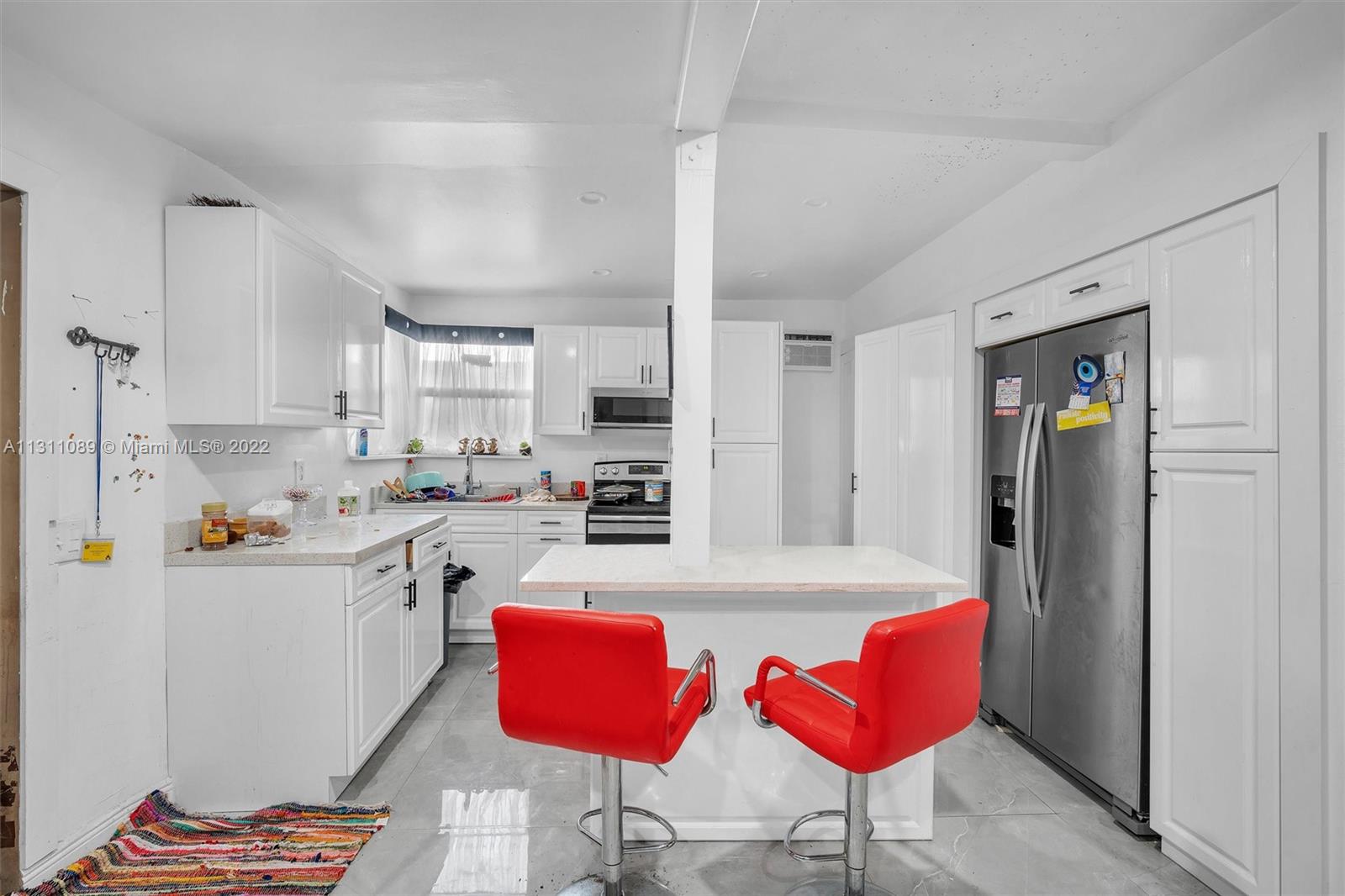 Allapattah Miami, FL 33125 - Photo 30 of 37 a kitchen with stainless steel appliances kitchen island granite countertop a refrigerator and a stove top oven