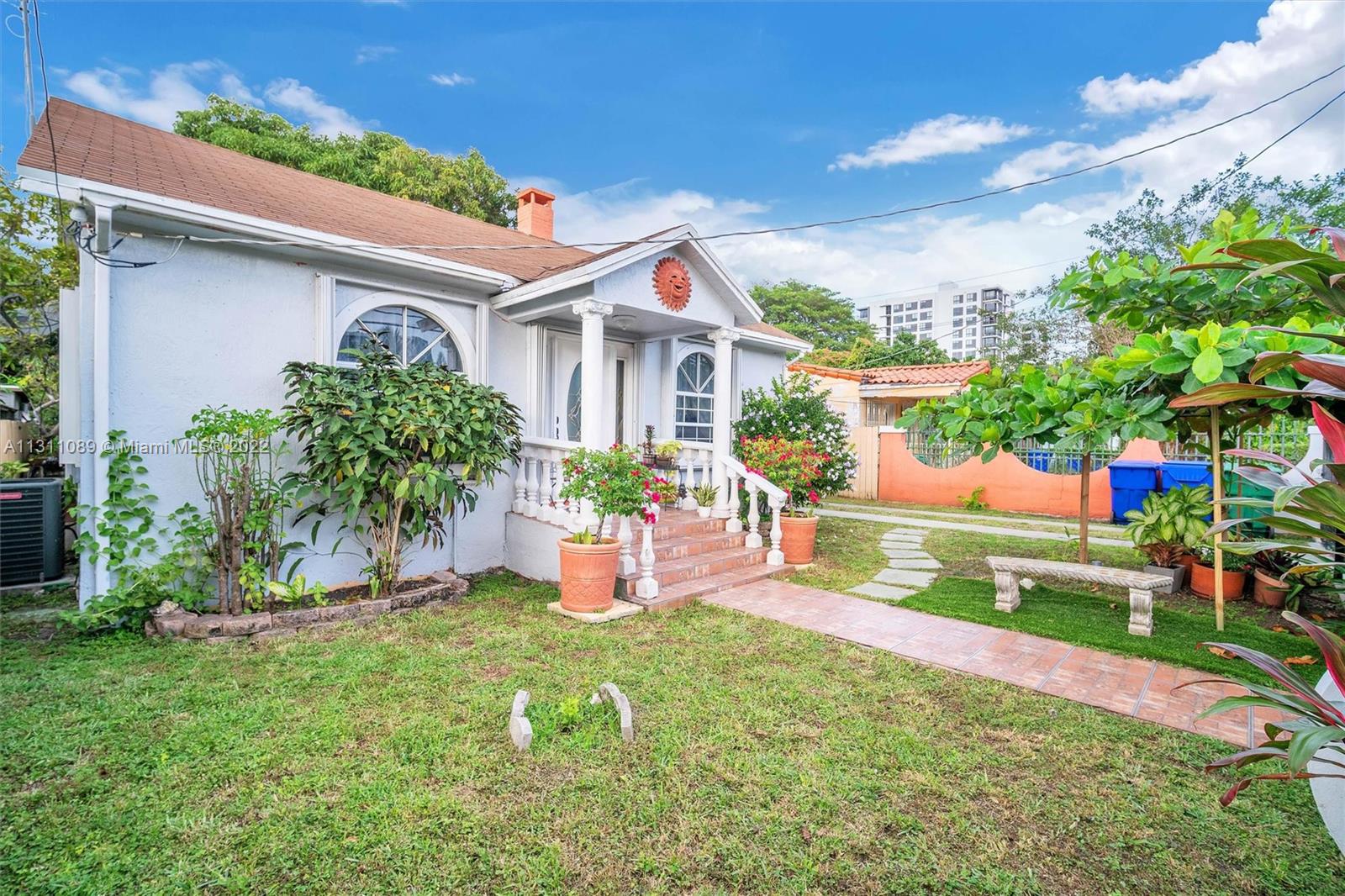 Allapattah Miami, FL 33125 - Photo 3 of 37 a front view of house with a garden