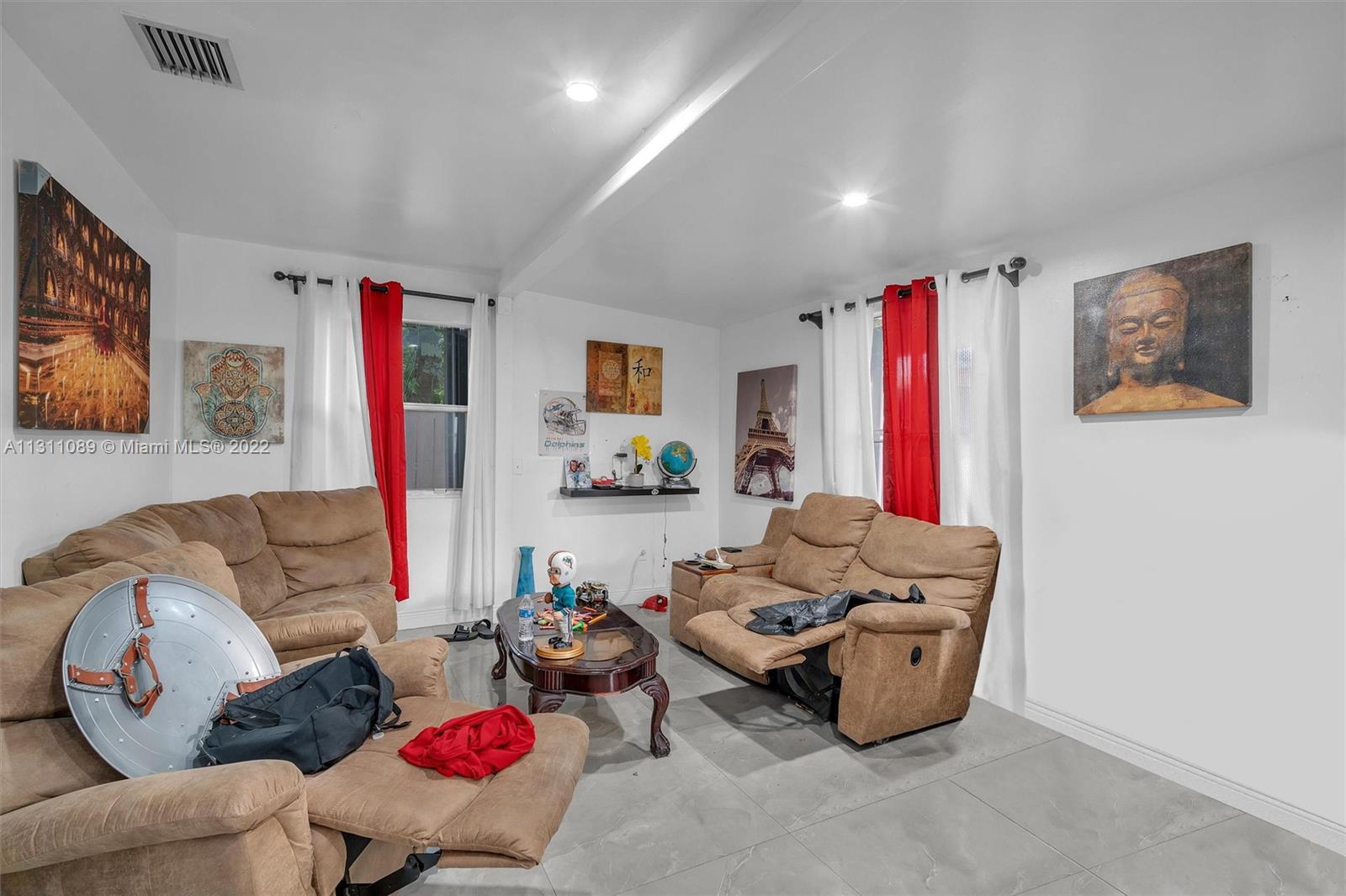 Allapattah Miami, FL 33125 - Photo 32 of 37 a living room with furniture and a flat screen tv