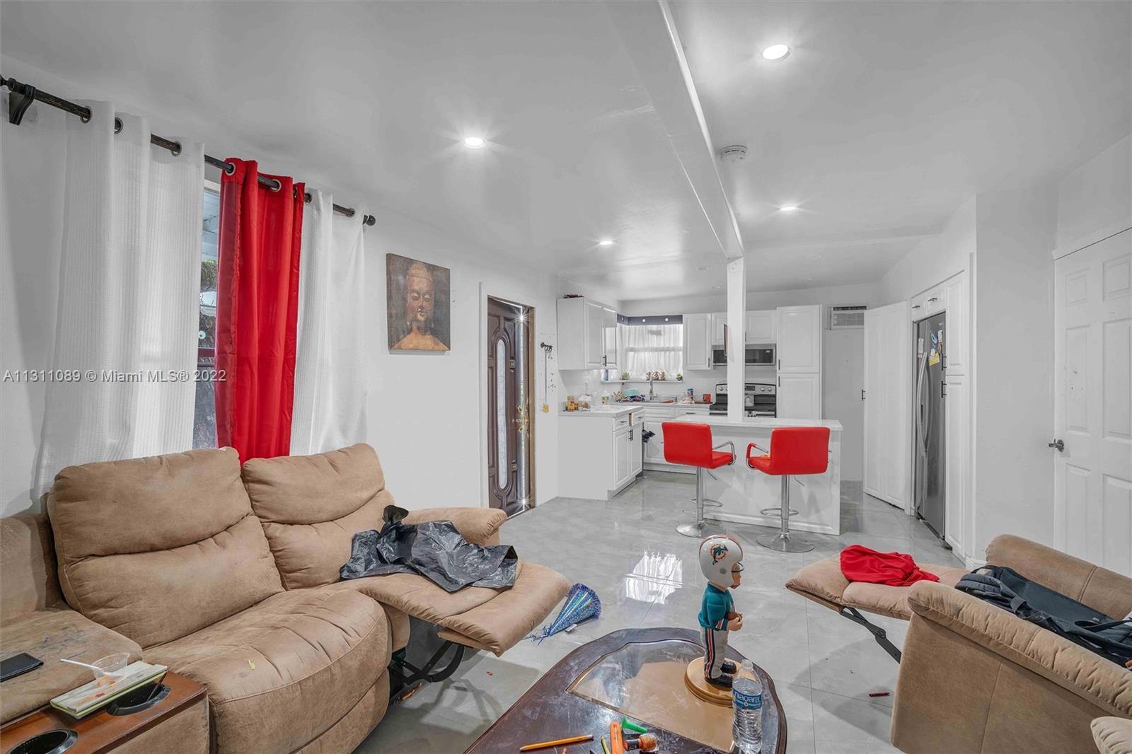 Allapattah Miami, FL 33125 - Photo 33 of 37 a living room with furniture and a wooden floor