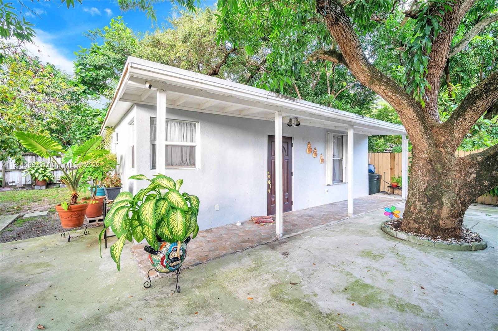 Allapattah Miami, FL 33125 - Photo 34 of 37 a view of a house with a yard and large tree