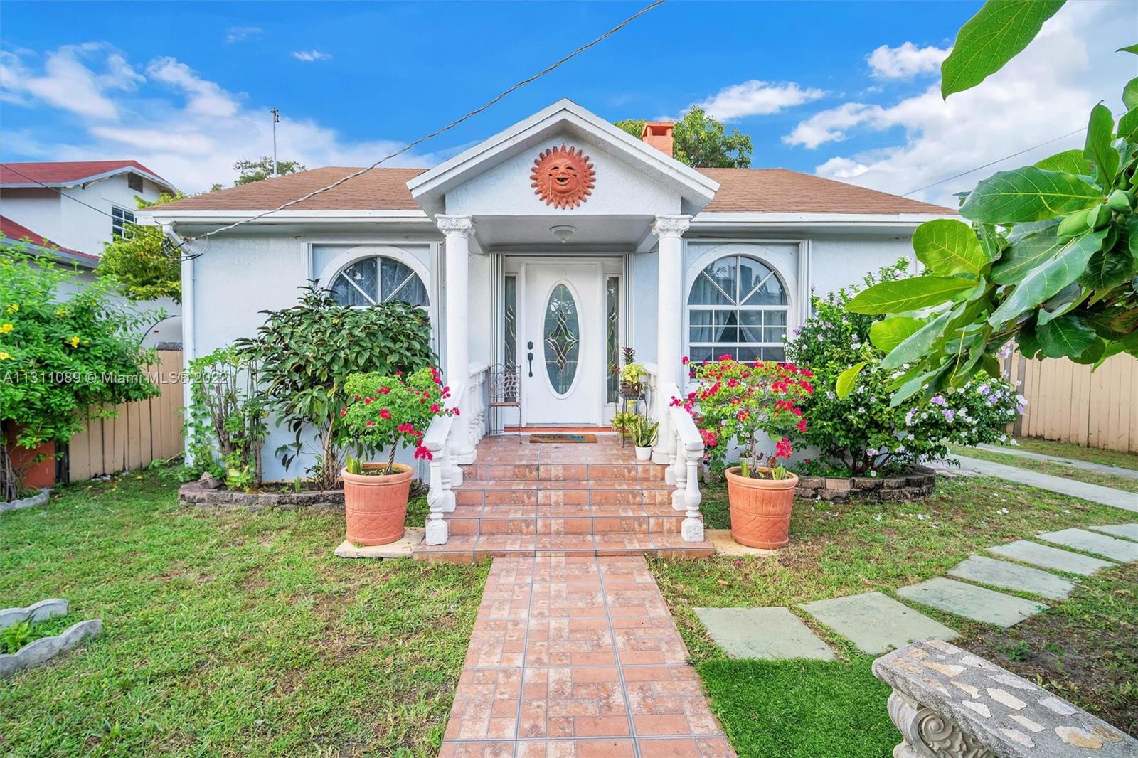 Allapattah Miami, FL 33125 - Photo 4 of 37 a front view of a house with a garden