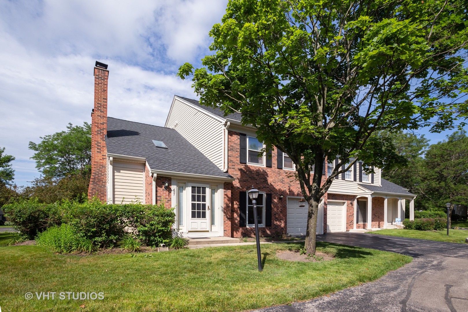 67 Bright Ridge Drive Schaumburg, IL 60194 - Photo 1 of 16 a front view of a house with a yard