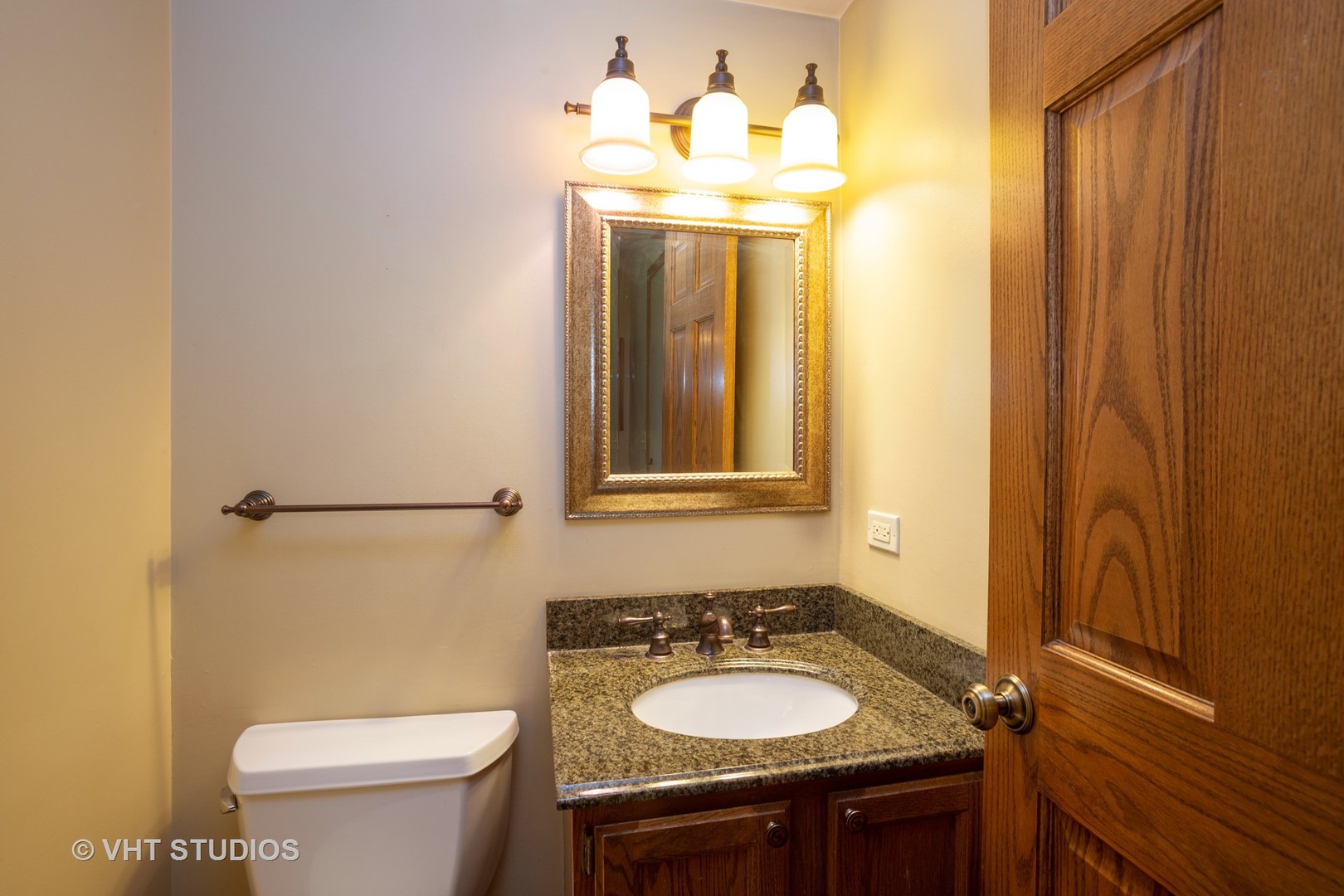 67 Bright Ridge Drive Schaumburg, IL 60194 - Photo 15 of 16 a bathroom with a sink vanity mirror and toilet