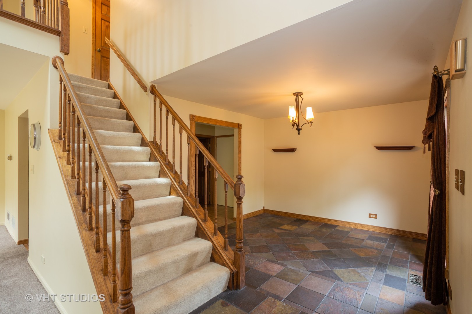 67 Bright Ridge Drive Schaumburg, IL 60194 - Photo 7 of 16 a view of staircase with white walls and railing