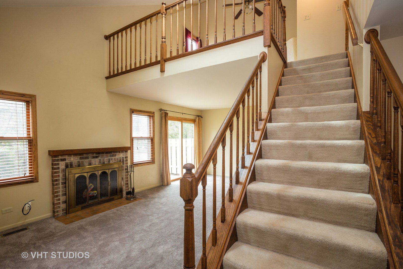67 Bright Ridge Drive Schaumburg, IL 60194 - Photo 9 of 16 a view of staircase with fireplace