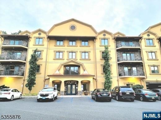 10 Lower Notch Road, Unit 8 Woodland Park, NJ 07424 - Photo 2 of 19 a car parked in front of a building