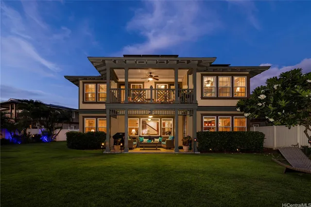 a front view of a house with a yard table and chairs