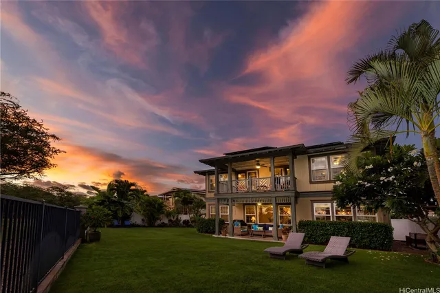 a view of house with a yard