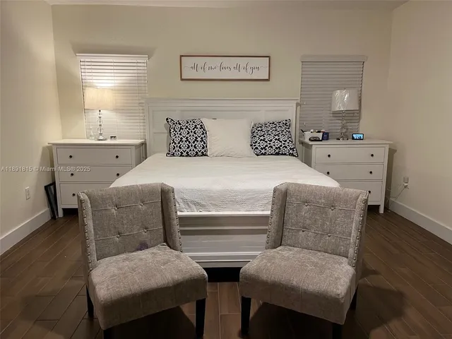 a bedroom with two beds and painted walls