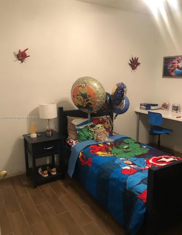 a bedroom with a bed and cabinets