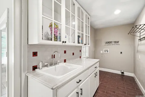 a bathroom with a sink a vanity and a mirror