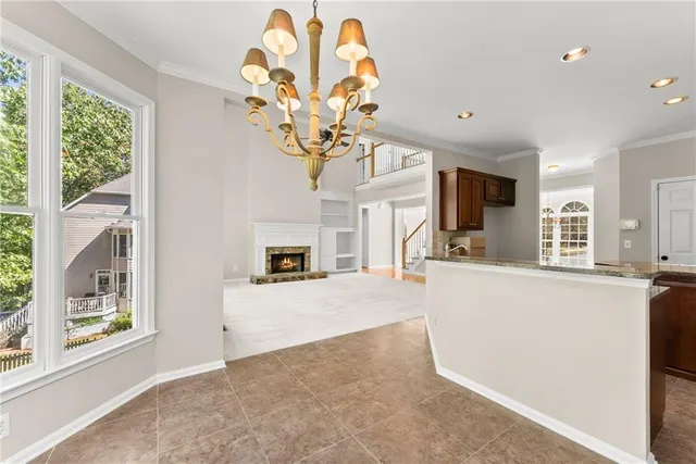 a kitchen with stainless steel appliances a stove sink microwave and cabinets