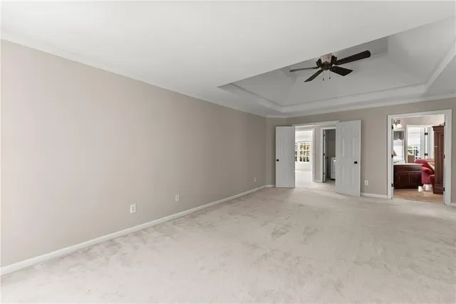 a bathroom with a sink a toilet a mirror and shower curtain